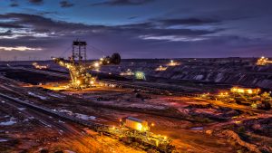 Illuminated Excavator Night Shot of Open Surface Coal Mining Garzweiler Germany - Mining, Energy and Resources - Gemstone Logistics